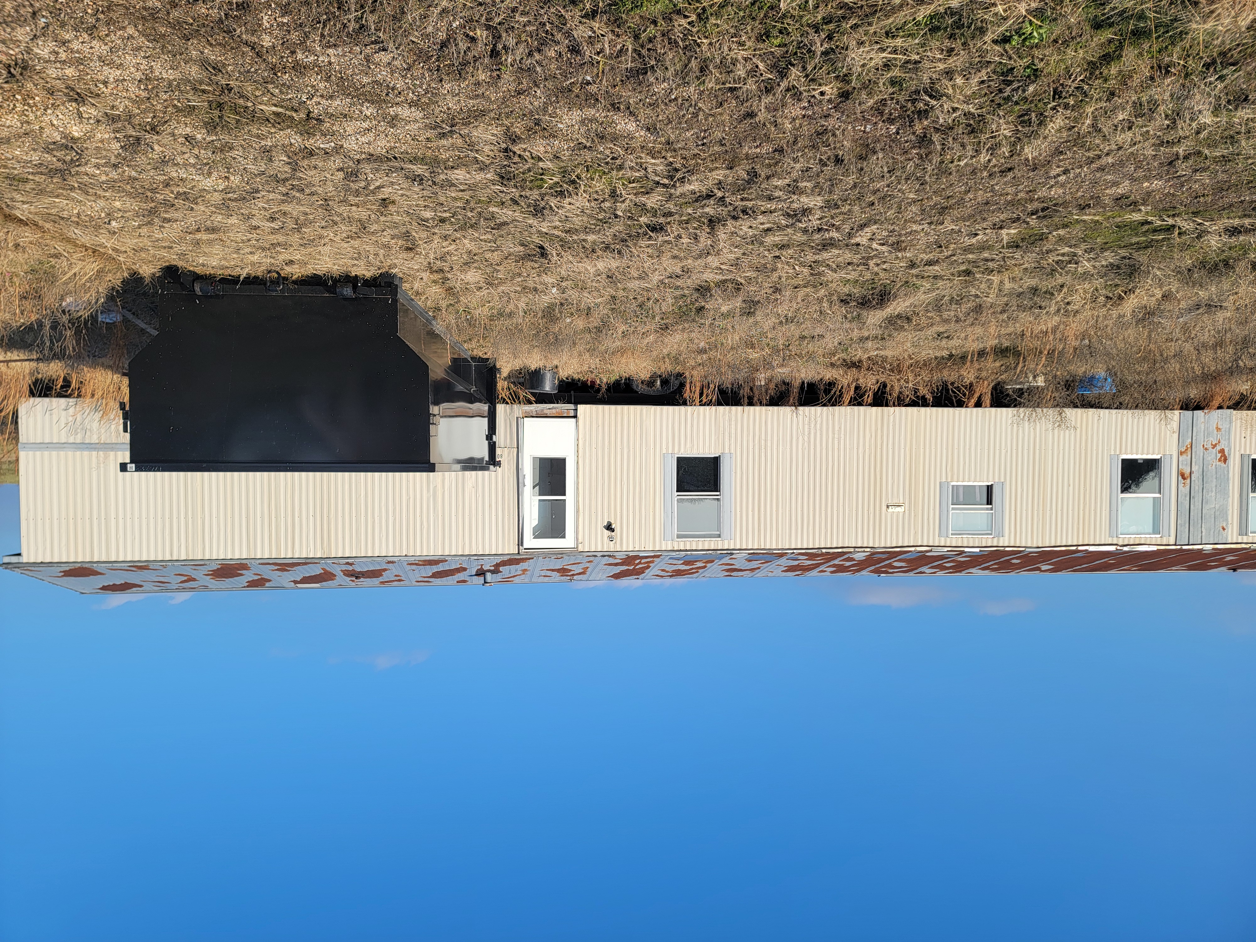 Dumpster being loaded with debris